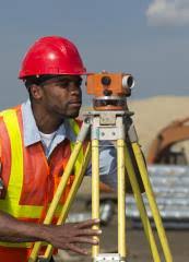 Surveyor working with equipment in the field